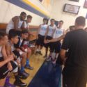 Basketball travel team time out as coach preps team for win.