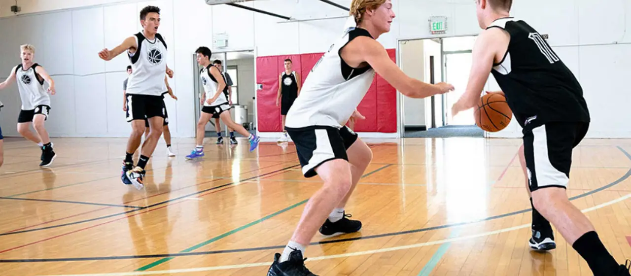 Campers spread the floor during 5 on 5 at basketball camp