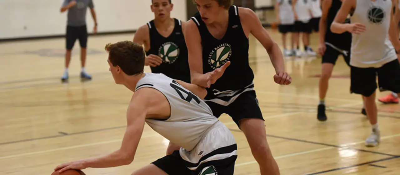 Athletes compete in an intense basketball game