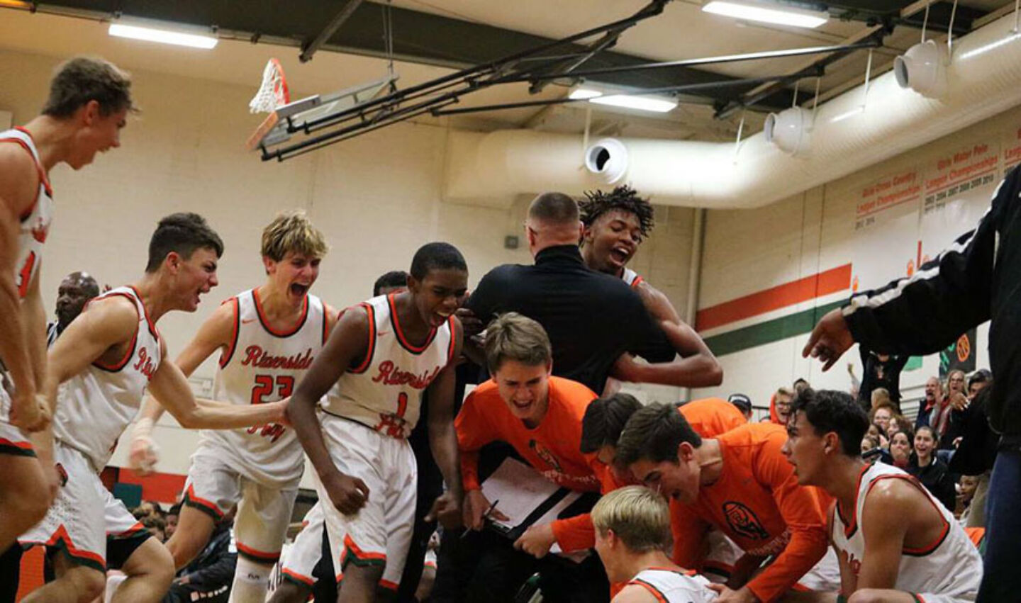 Winning team dogpiles in celebration