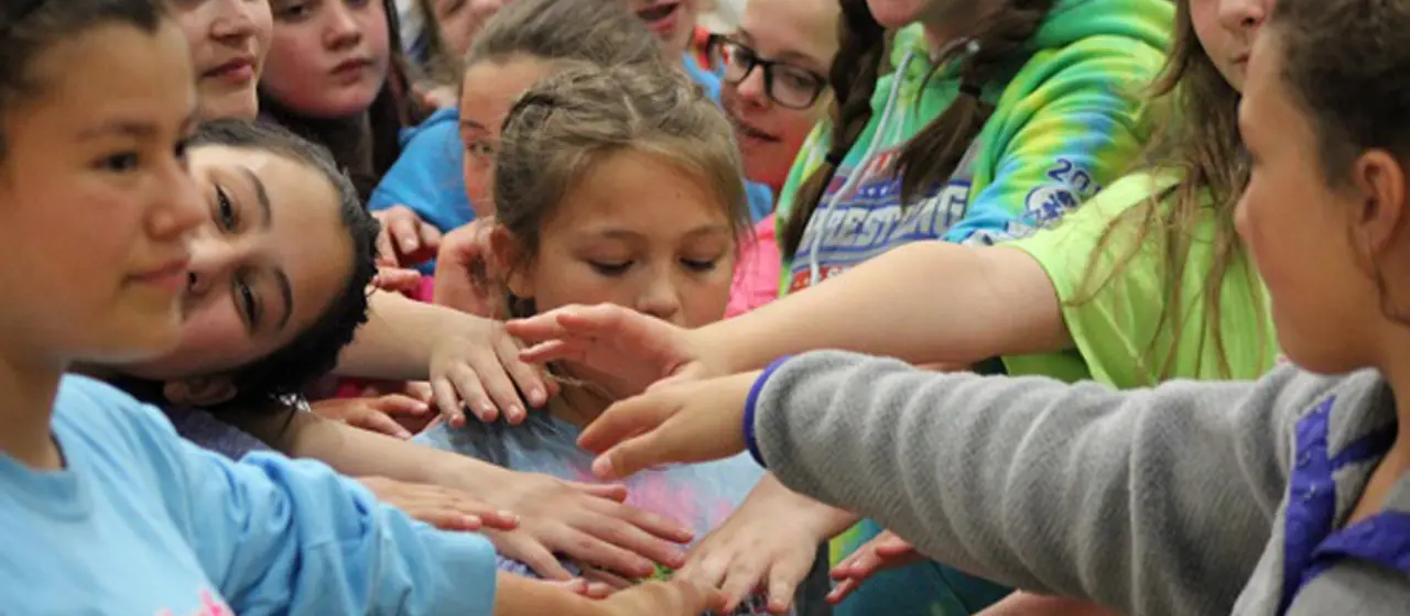 Campers huddle after NBC volleyball intensity night