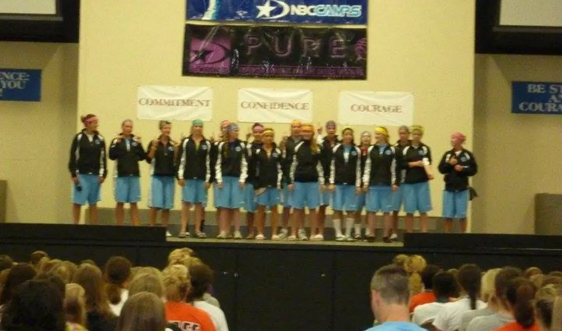 Girls basketball travel team speaks during basketball camp at NBC Auburn