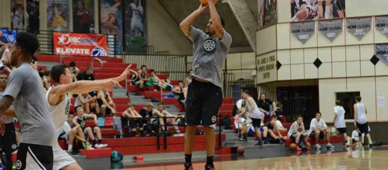 Coach pulls up for a jumper in the coaches versus camper tournament games at College Basketball Prep Camp at Whitworth University