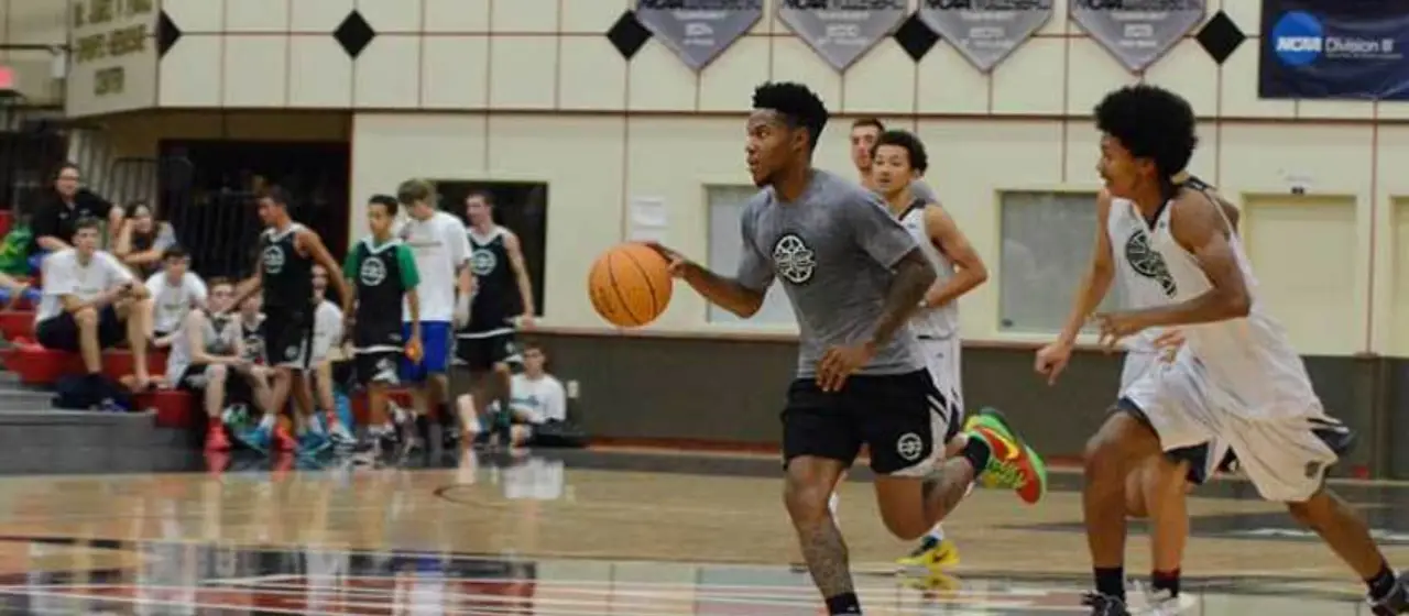 Athlete runs the court during fast break at NBC Basketball Camps