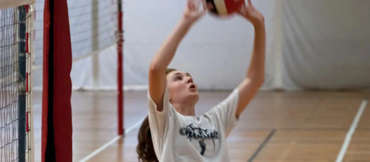 NBC Volleyball camper lines up for setting the ball.