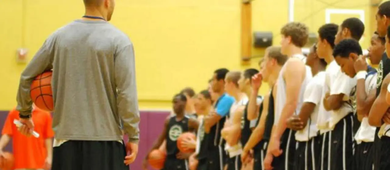 College basketball prep camp athletes line up for tournament drafting.