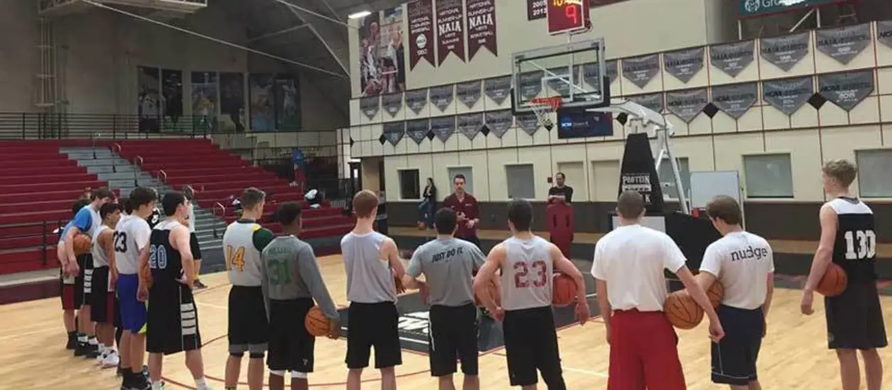 Players to listen to coach during basketball camp training session