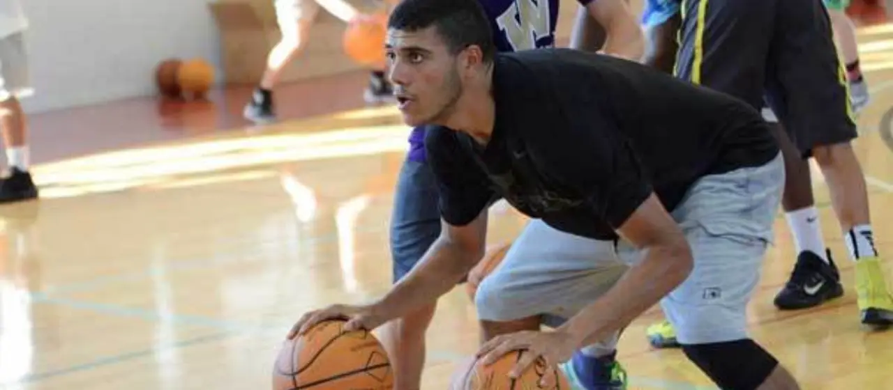 Athlete practices two ball drills during NBC Basketball ball handling session.