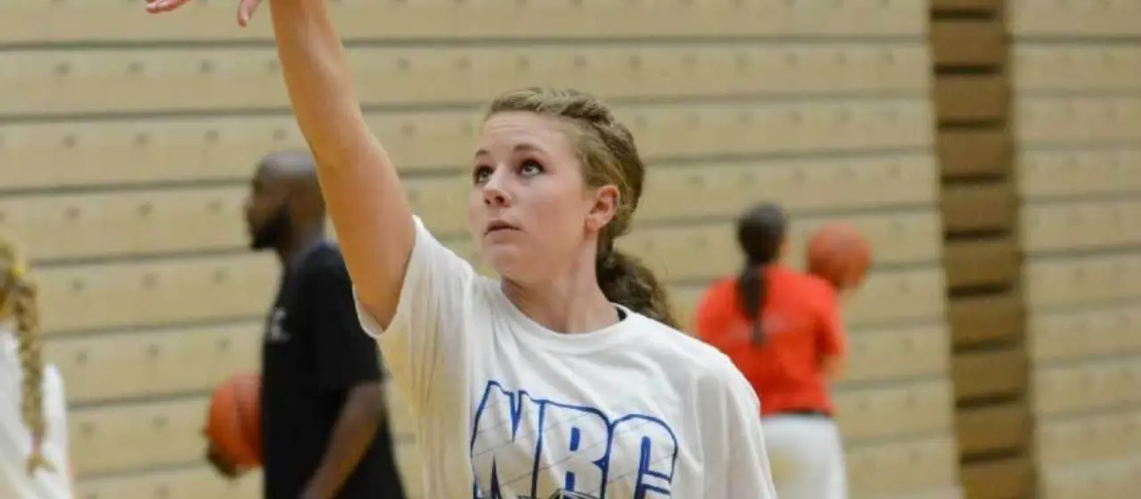 Camper holds follow through on shot during NBC Basketball shooting station