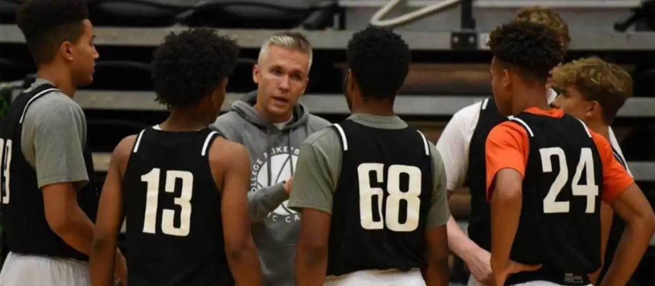 College Basketball prep coach Jay Crowell encourages his team during a time out.