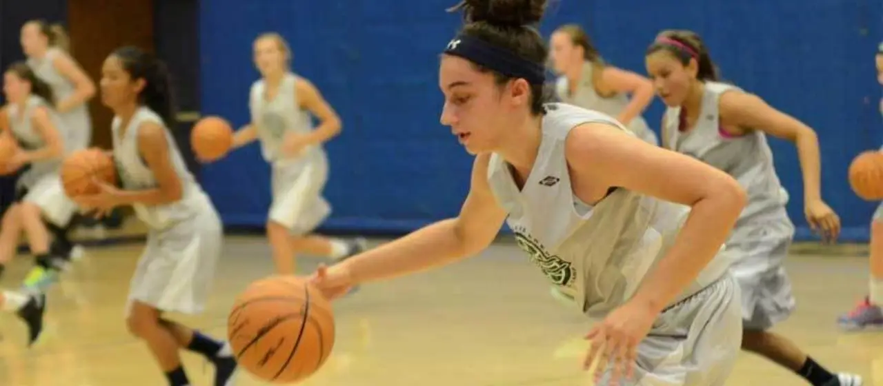 Girls push their basketball skill workout at NBC Camps