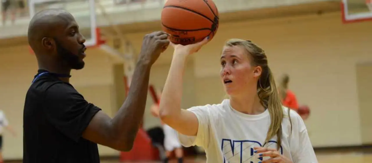 Coach points out how to create space on form shooting at camp