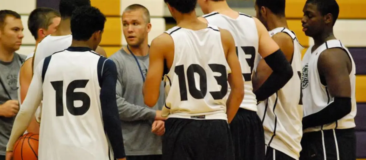 NBC Basketball college prep team comes together during a time out for instruction.