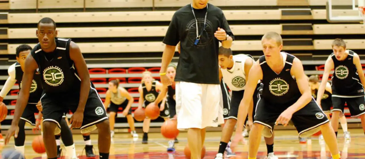 Coaches time athletes in competitive ball handling drills at NBC Basketball Camps