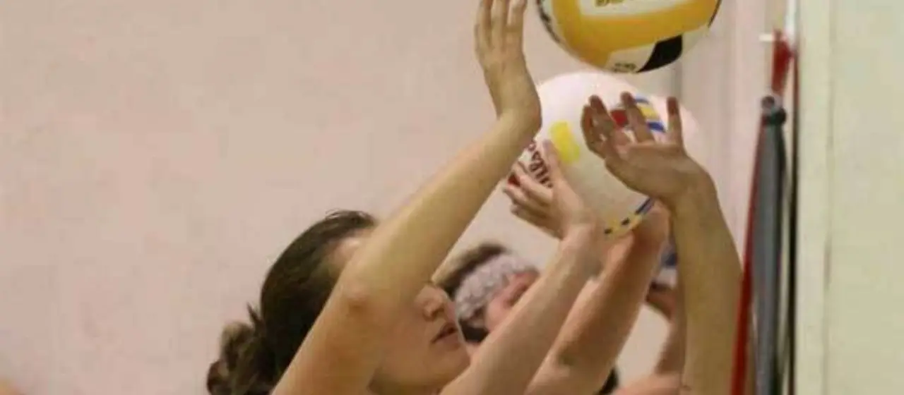 Volleyball Campers work on serving against a wall at NBC Volleyball Camp