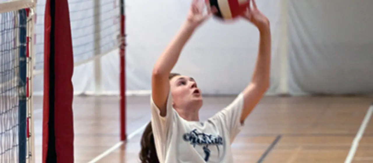 Setter eyes the ball at volleyball camp