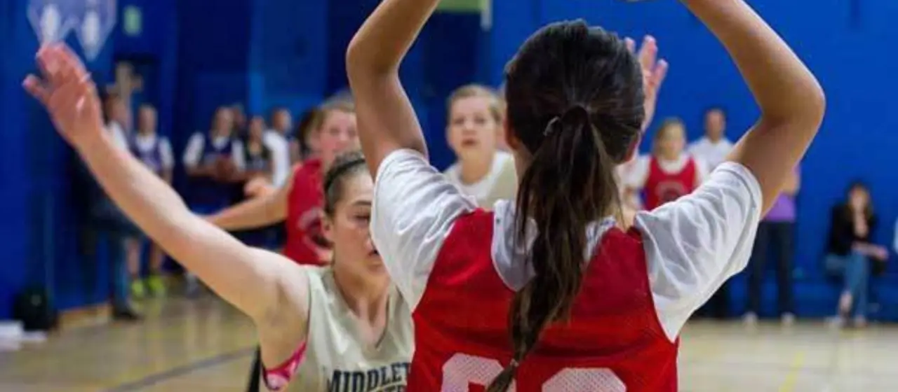 Girl sees the floor during camp tournament.