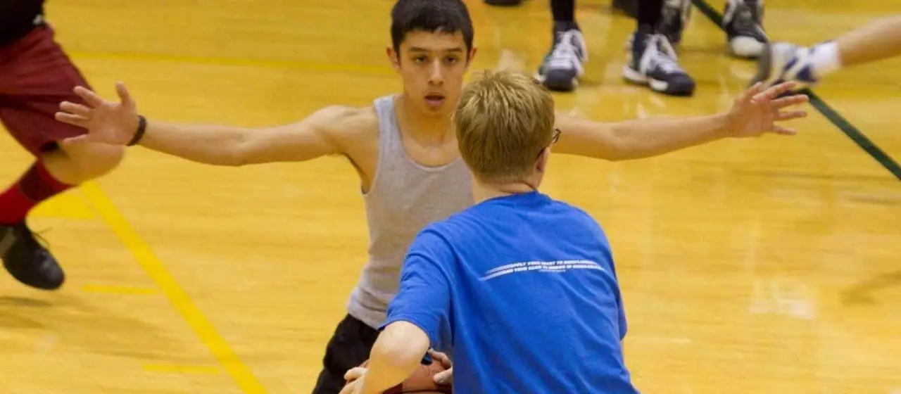 Camper plays defense during camp games at NBC Basketball Camps