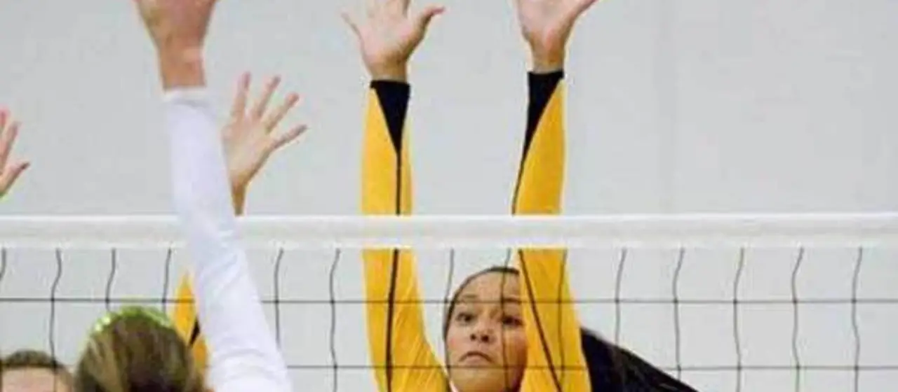 Campers practice blocking at volleyball camp