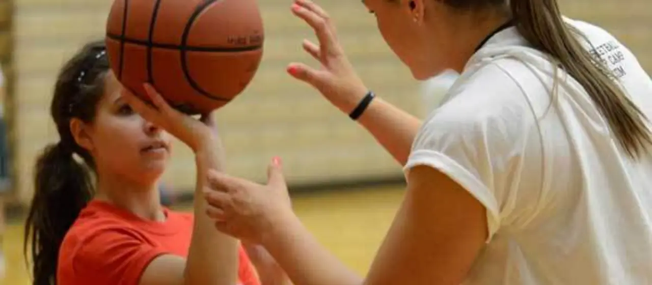 Coach adjusts camper's shot at NBC Basketball Camps