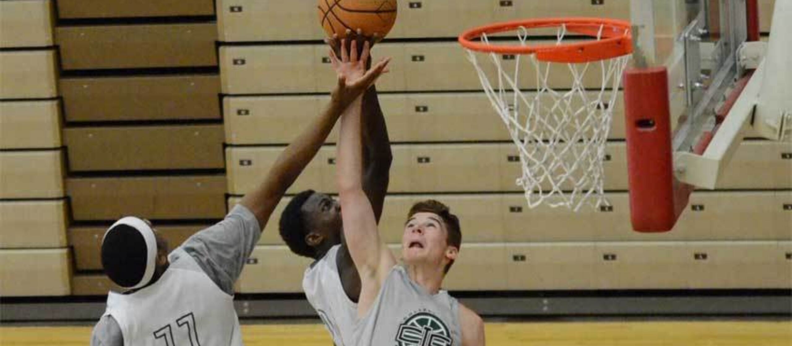 Athletes contend for the rebound at NBC Basketball Camps
