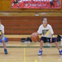 Basketball junior camp girls dribbling