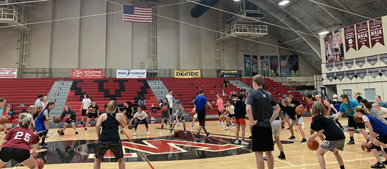 Girls workout at ball handling station at NBC Basketball Camps at Whitworth University