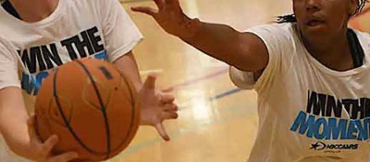 High School Girls Basketball players battle for the win at NBC Basketball Camps