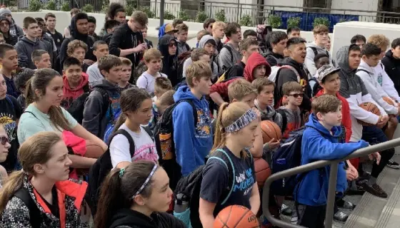 NBC Alaska Basketball Camp campers line up for morning roll call before heading to ball handling