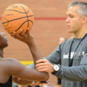 NBC Basketball Coach adjusts players shooting form for optimum accuracy in pure shooting camp