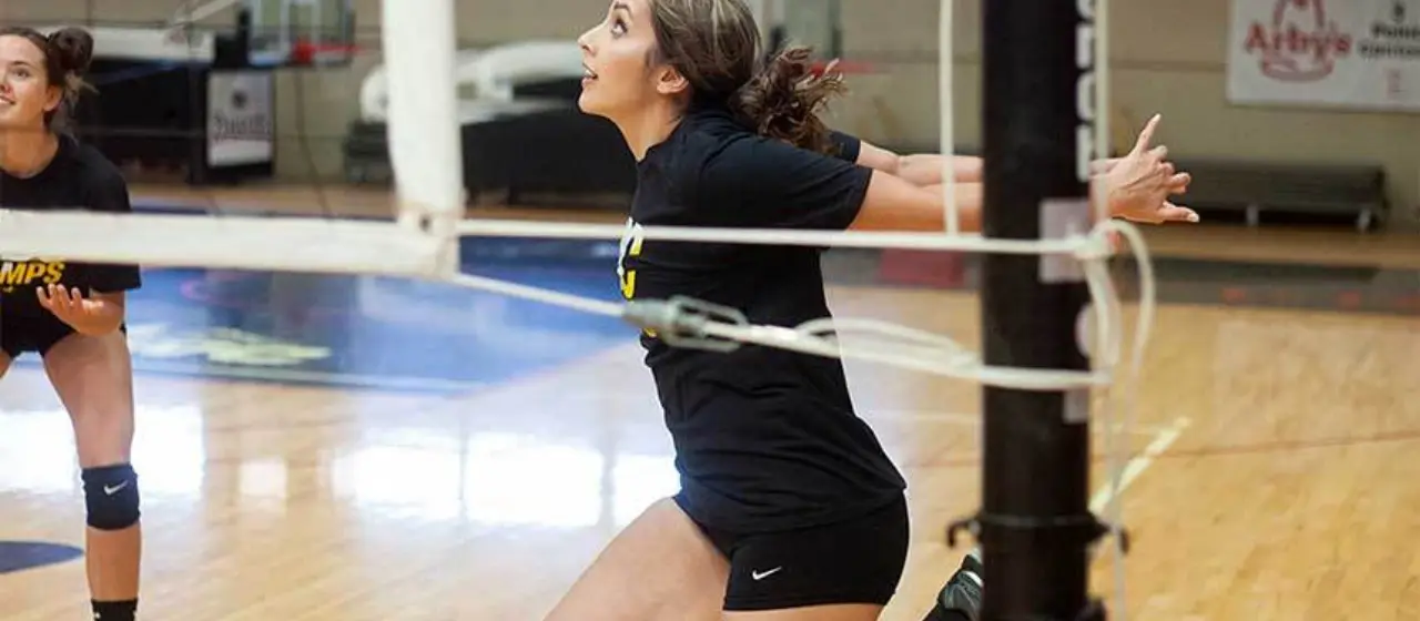 NBC Volleyball player attacks the net